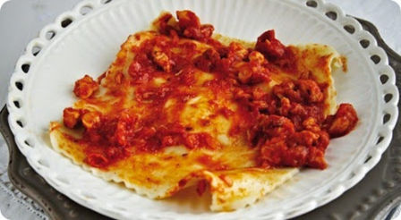 Tortelloni di verza e squacquerone con ragù di coniglio.