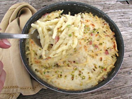 Ricetta trofie al pistacchio con mortadella e provola, una variante al forno da provare